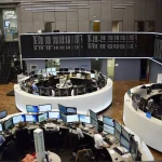 Traders' desks and market screens at the Frankfurt Stock Exchange