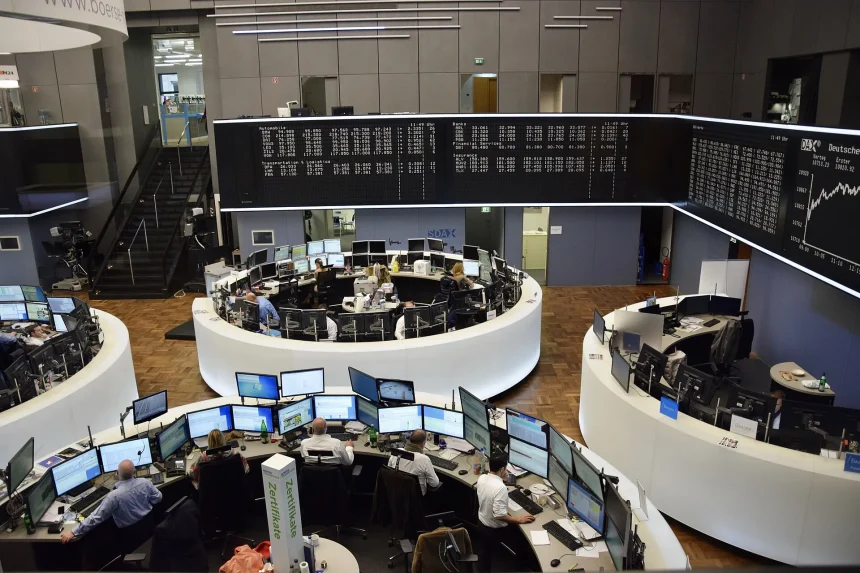 Traders' desks and market screens at the Frankfurt Stock Exchange